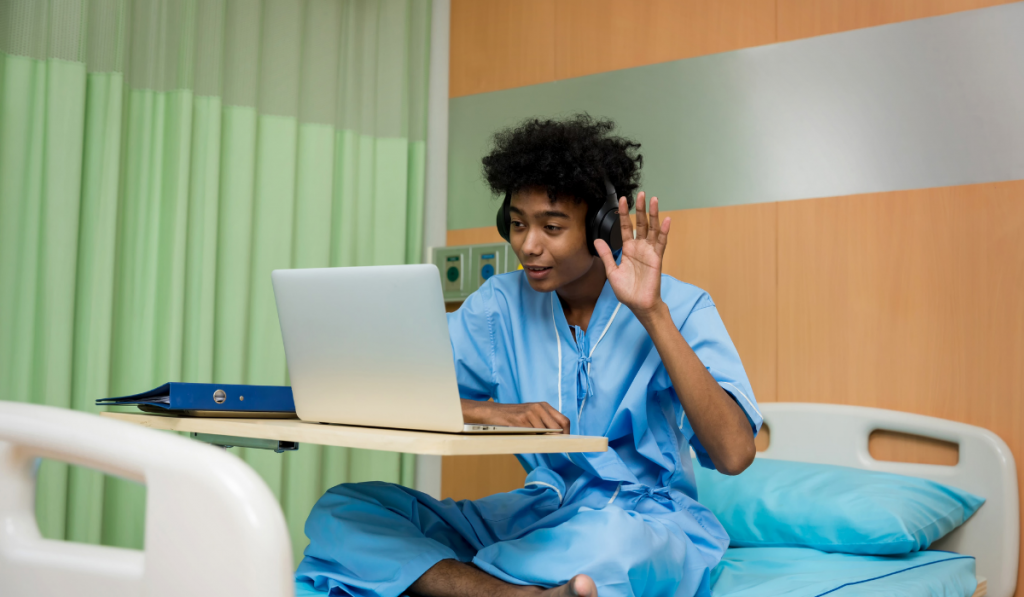 patient in the hospital having a video chat with his love ones on the laptop 