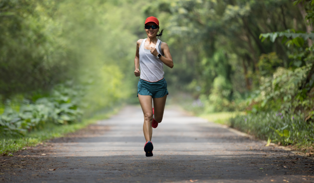 Fitness woman runner running in the park