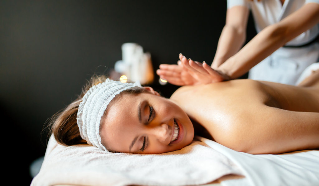 Massage therapist massaging woman
