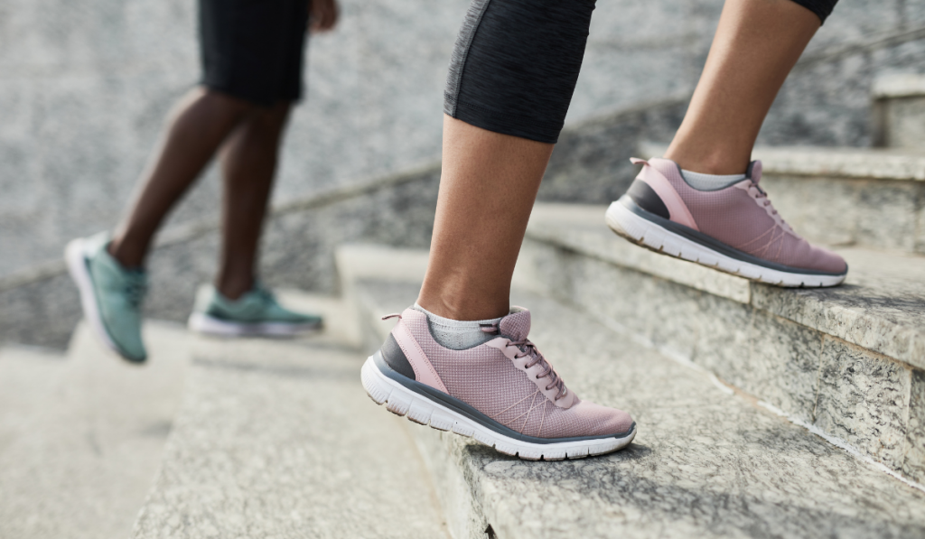 close up of couple's running shoes while walking the stairs