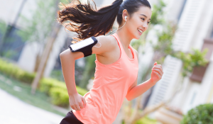 Young-woman-jogging-and-listening-to-music