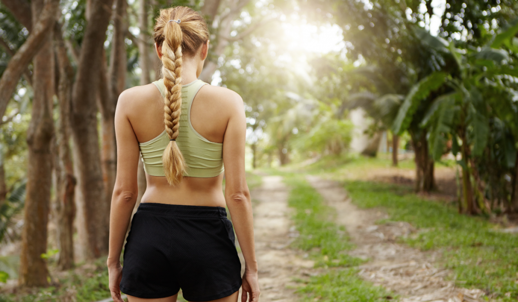 female runner in black running shorts with liners