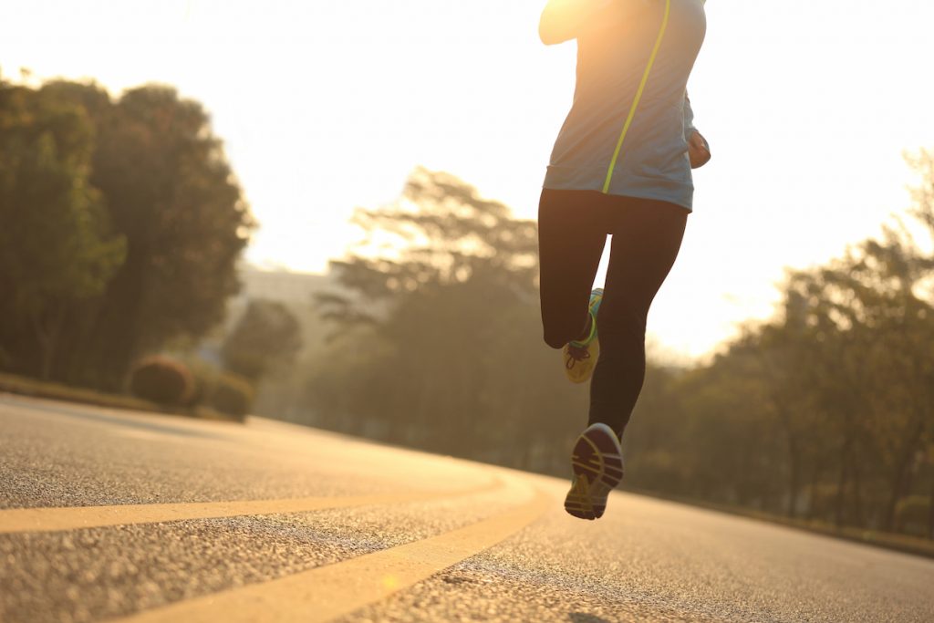 running legs on a road 