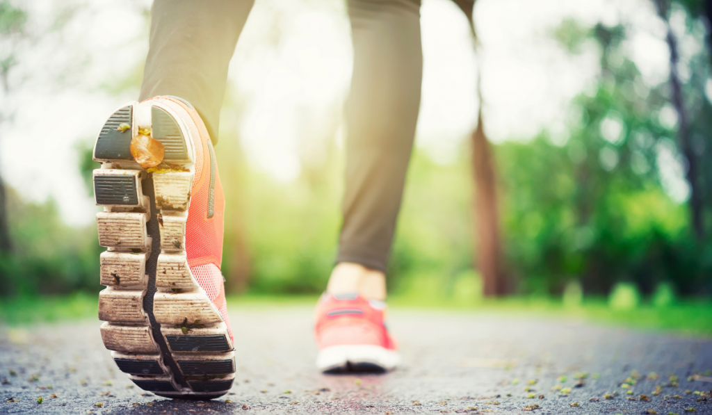 woman in pink shoes running