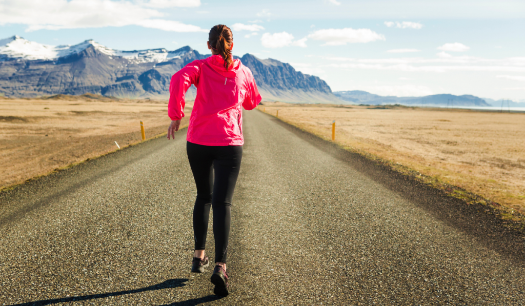 Shot of a beautiful woman running in a beautiful afternoon