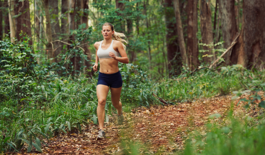 woman running outdoors in the forest