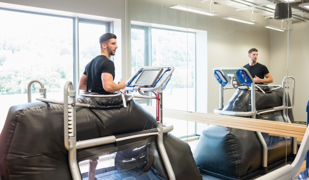 Athlete working out on an anti gravity treadmill at the gym